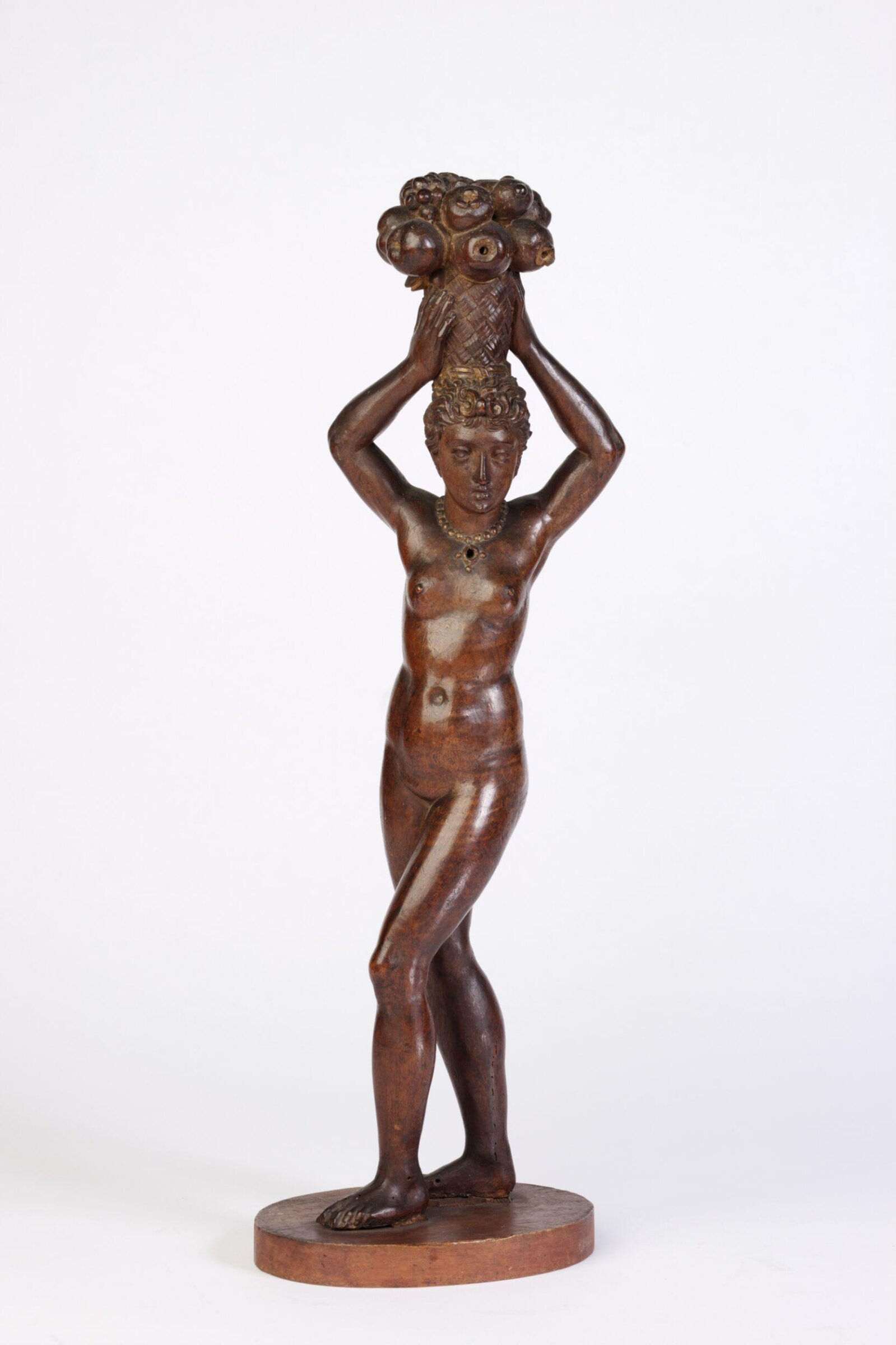 Female figure carrying a basket of fruit, second quarter of 19th century