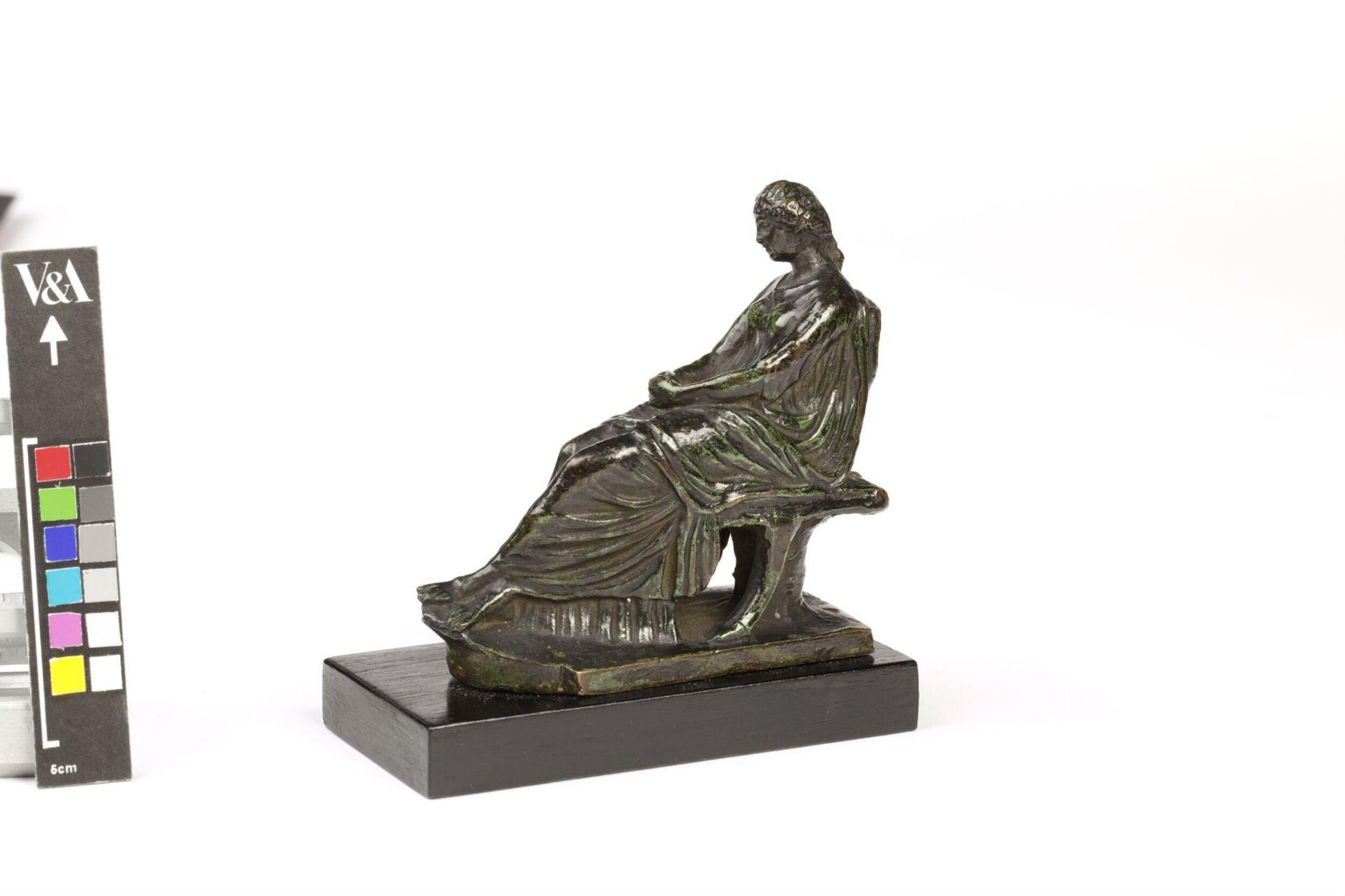 Seated female figure, ca. 1900