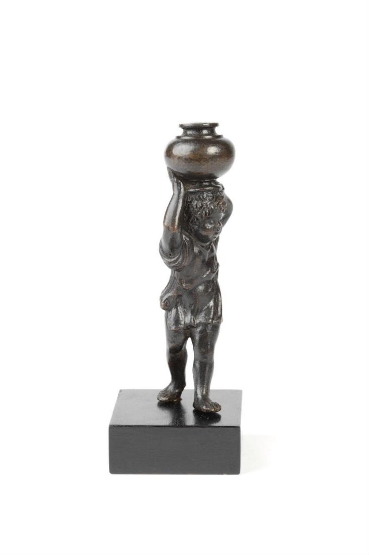 Boy carrying a vase top image