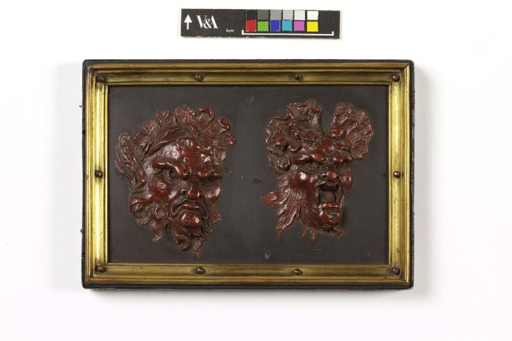 Two grotesque masks top image