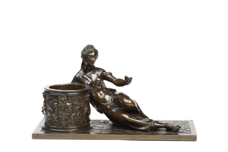Inkstand with a reclining woman top image