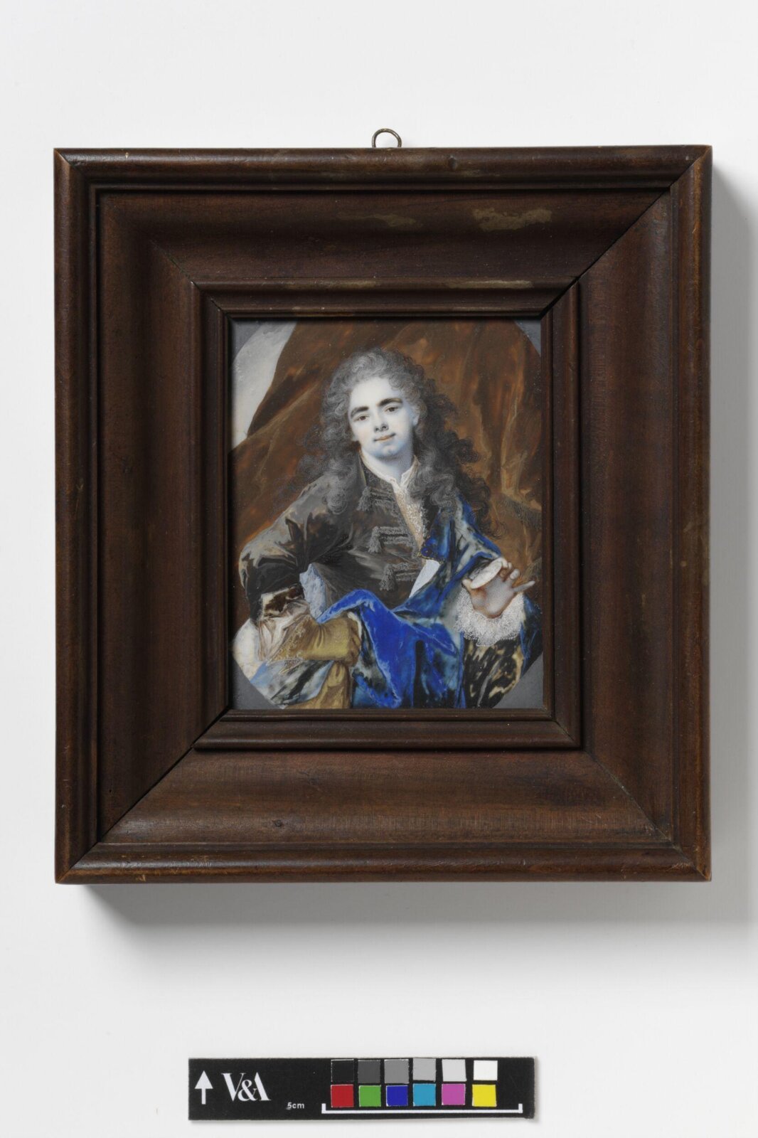 An Unknown man holding a miniature, early 18th century