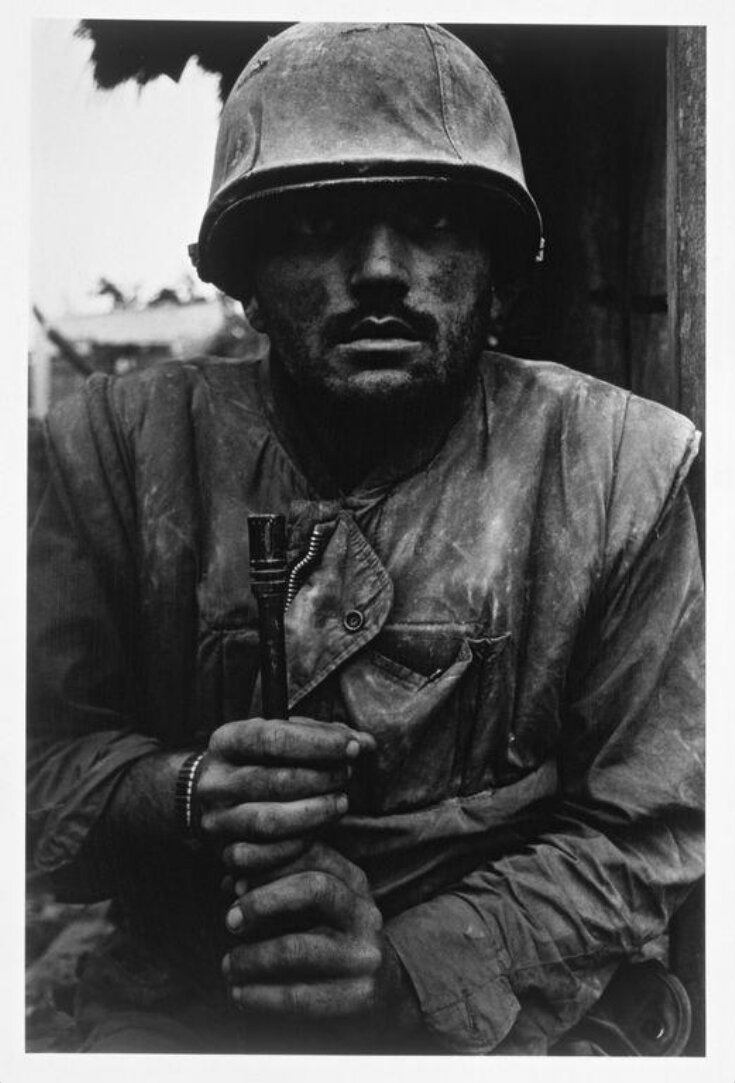 Shell-shocked soldier awaiting transportation away from the frontline,  Hue top image