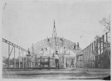 Exterior view of the roof of the South Kensington Museum ('the Brompton Boilers') under construction with the houses of Cromwell Road and Thurloe Square visible in the background thumbnail 1