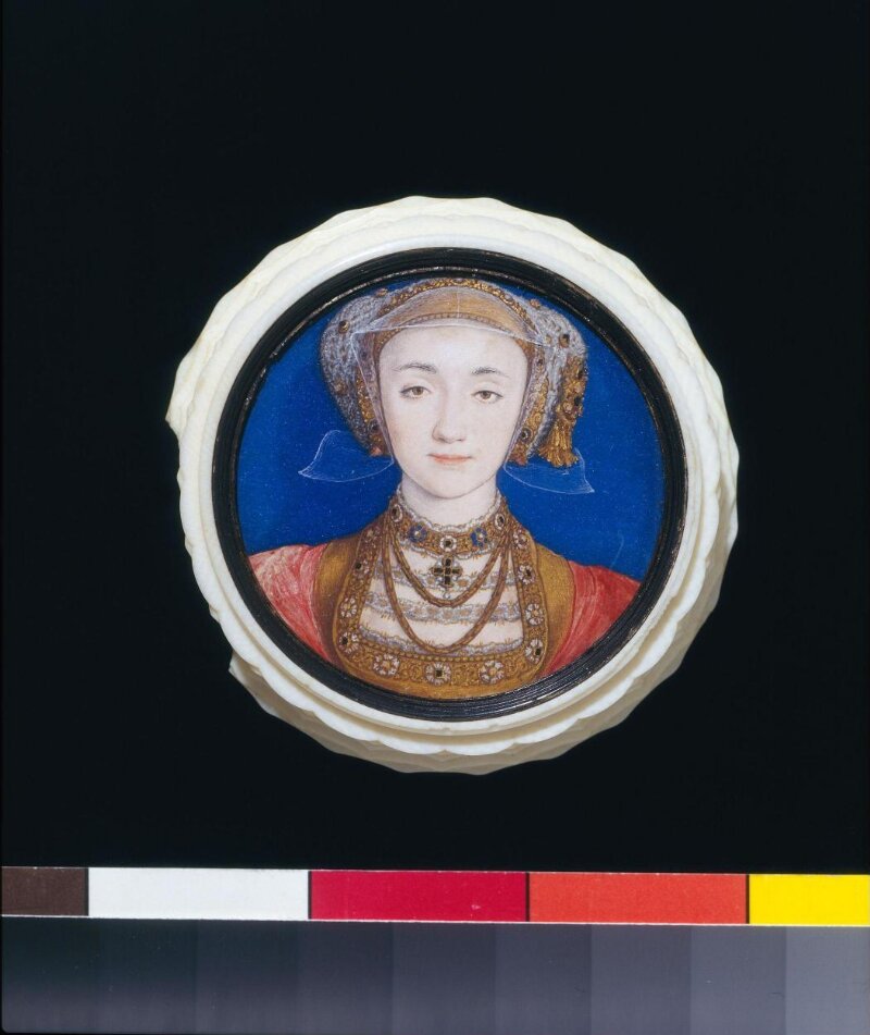 Photograph of an ivory box with a painting of Anne of Cleves on the lid. 
    The photograph includes part of a colour chart, giving some indication that the object is very small.