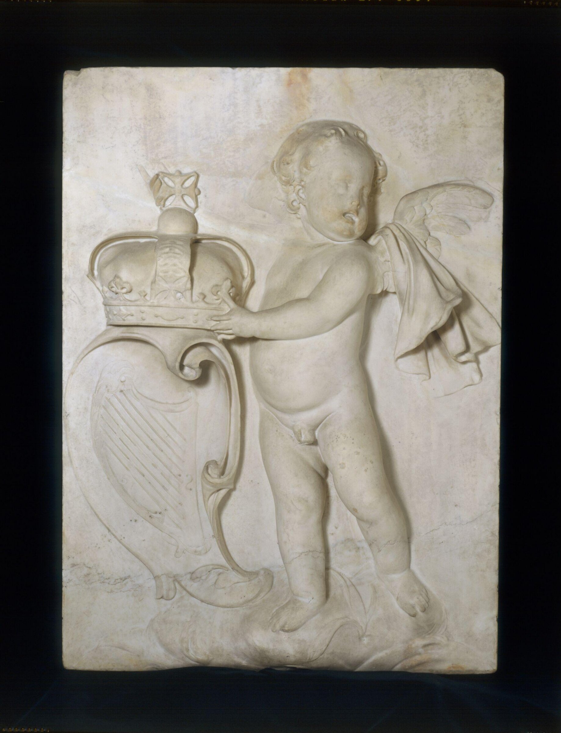 A Putto holding the Crown and coat of arms of Ireland, Grinling Gibbons, ca. 1686