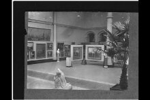 Victoria and Albert Museum, North Court, south-west corner, paintings exhibition, June 1915 thumbnail 1