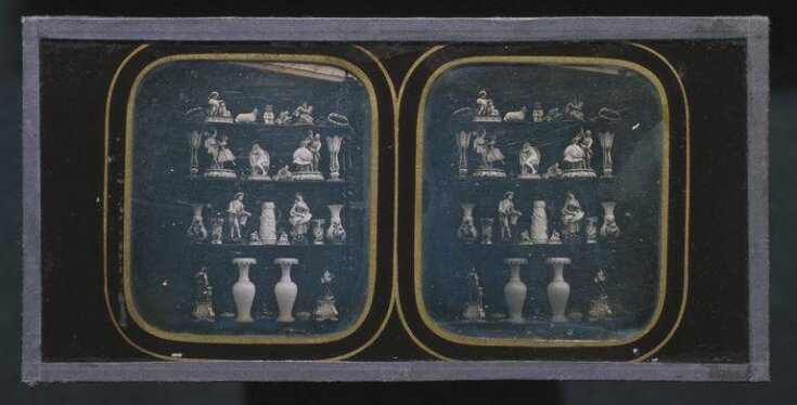 Four shelves of ceramic figures and vases top image