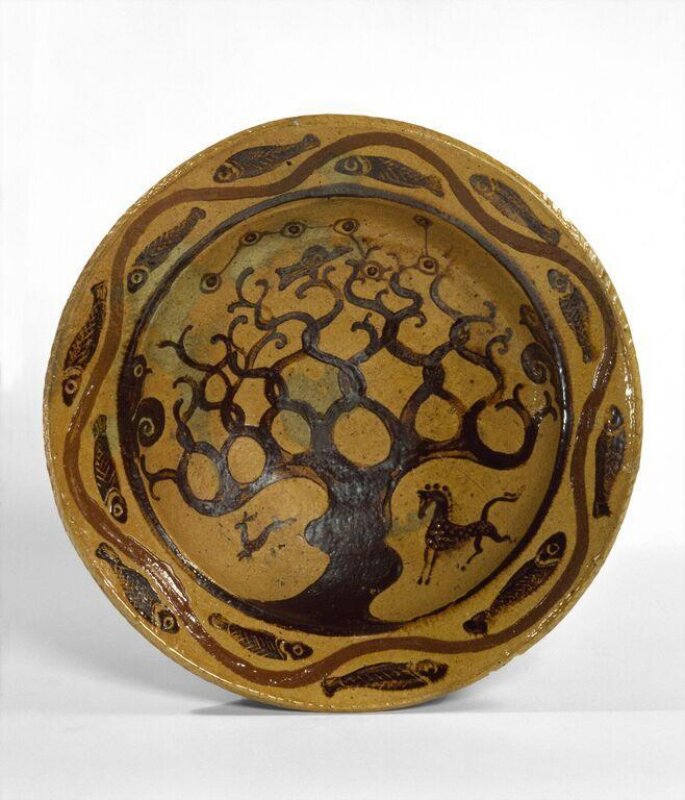 Bernard Leach’s 1923 St Ives Tree of Life dish, showing a branching dark tree, a horse and fish around the rim