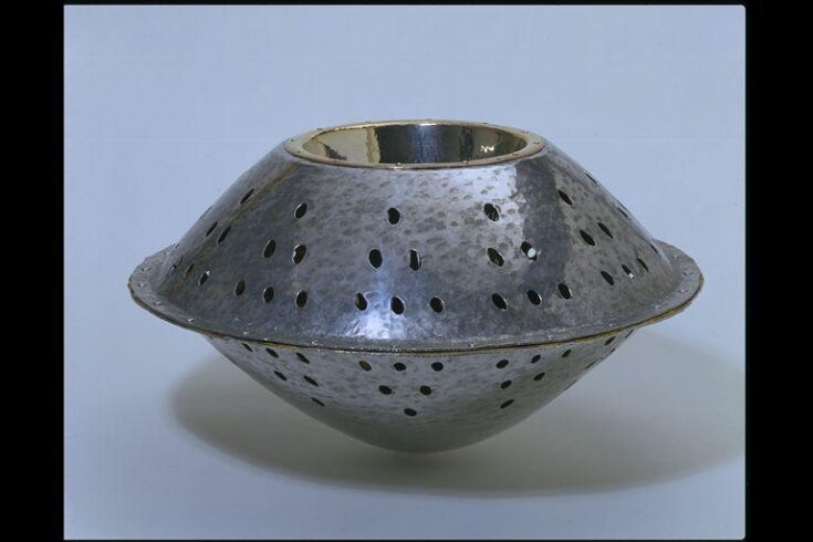 Vessel with a silver heart top image
