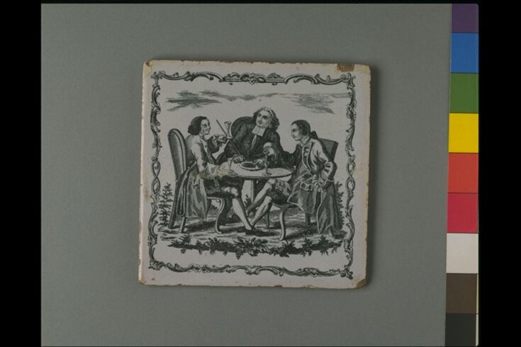 A Cleric and two gentlemen drinking at a table image