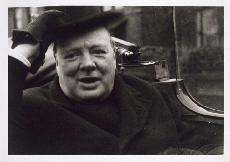 Winston Churchill, outside the polling station in his constituency, when he learned that he was successfully re-elected to Parliament (1935?). top image