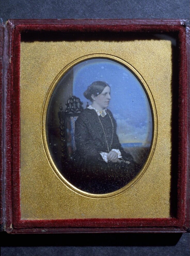 Portrait of a woman sitting top image