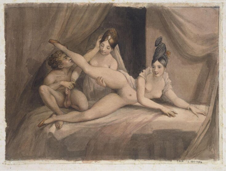 A man and two women on a bed. top image