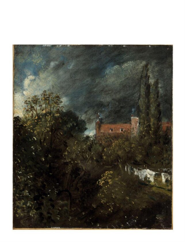 View in a Garden with a red house beyond