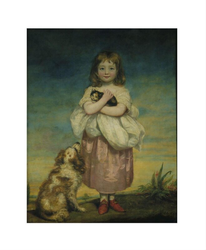A Little girl nursing a kitten