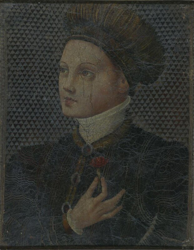 A young man holding a carnation