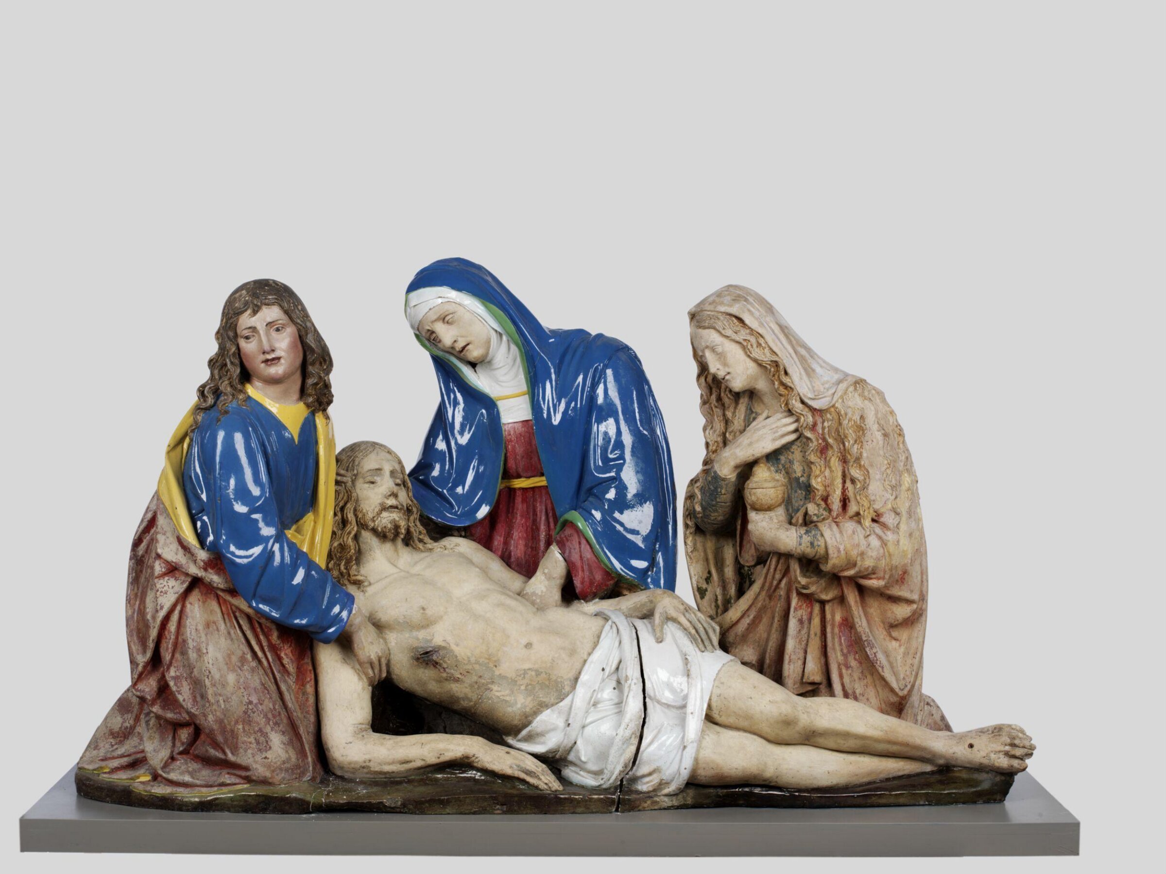 Lamentation over the Dead Christ with the Virgin, St John the Evangelist and Mary Magdalene; a Pieta., workshop of Andrea della Robbia, ca. 1510-1515