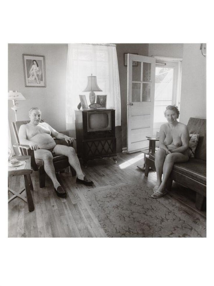 Retired man and his wife at home in a nudist camp one morning, N.J. 1963' top image