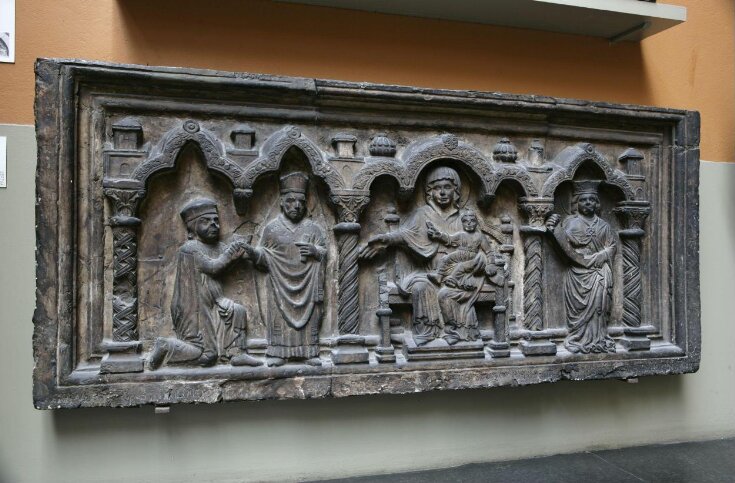 Virgin and Child enthroned between a saint and a bishop saint presenting a kneeling donor top image