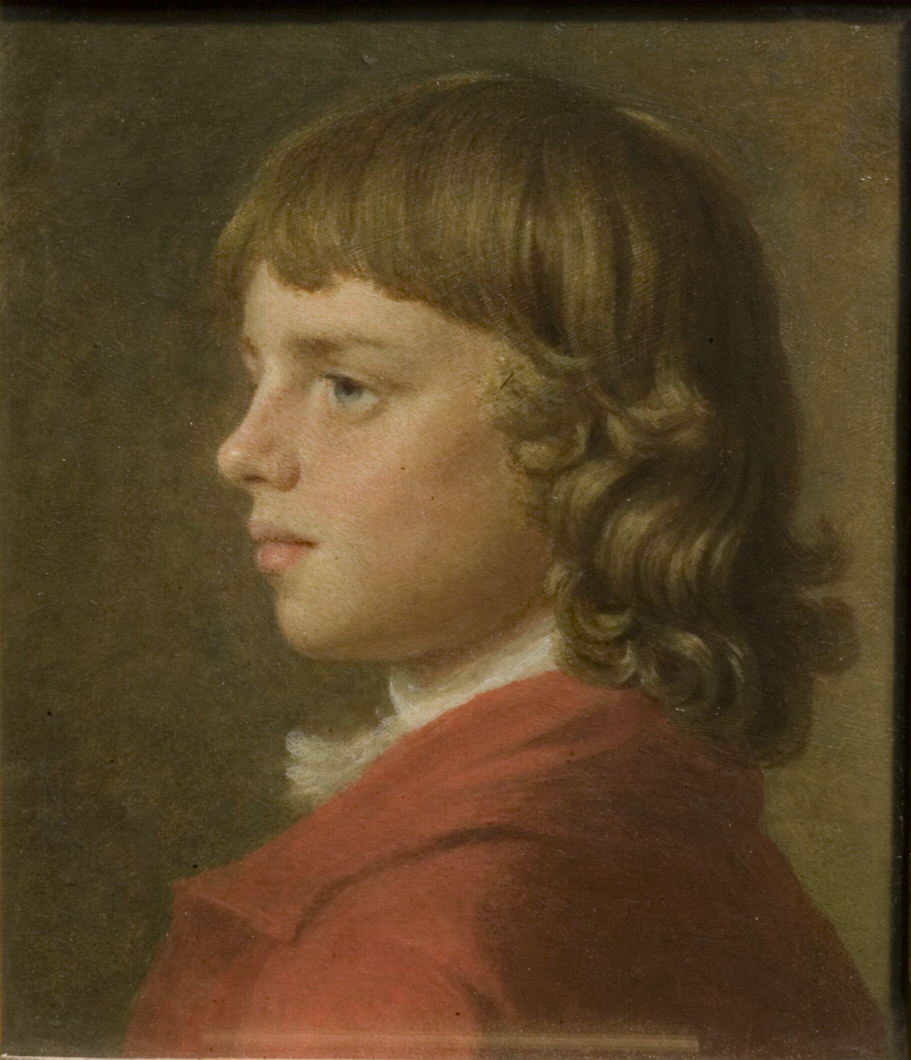 A boy in a red coat