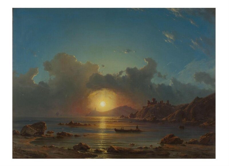 Sunset on a bay, with castle ruins