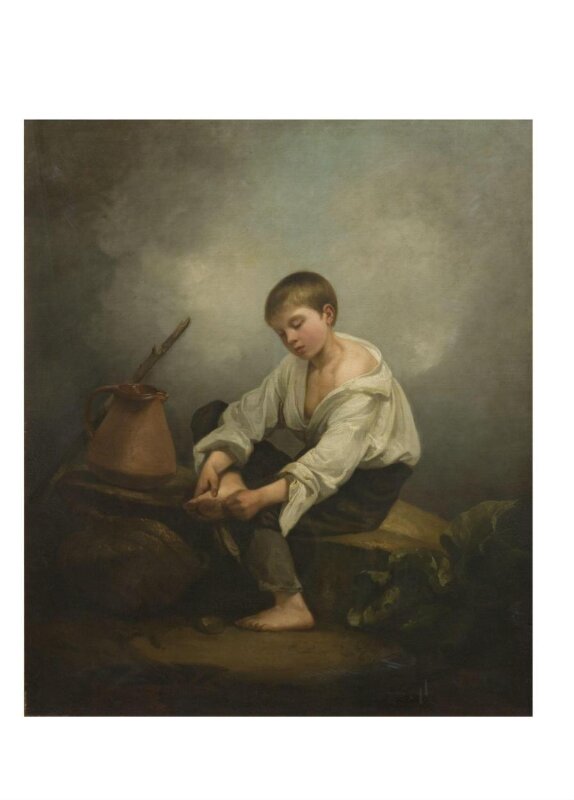 A Boy extracting a thorn from his foot