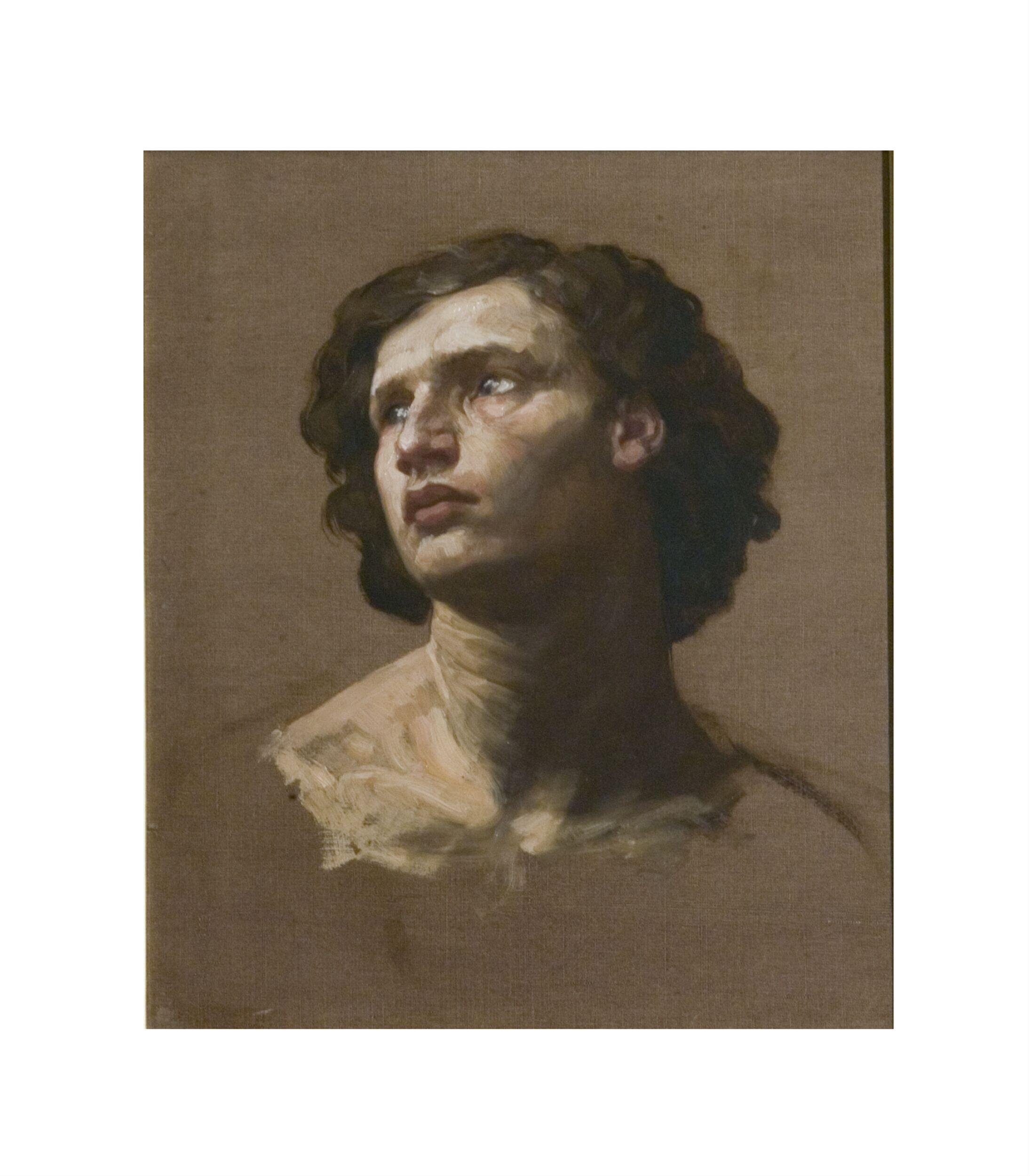 Head of a man looking upwards and sideways