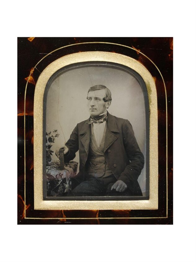 Portrait of a young man seated at a table (1854) by William Bond