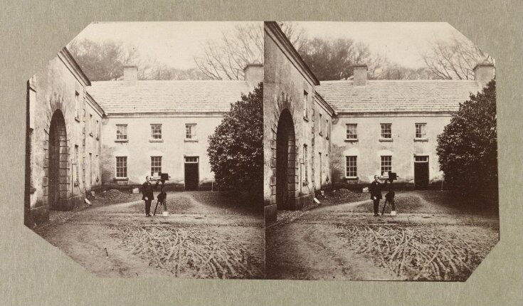 West Wing of Dundrum House with unidentified man with camera on tripod top image