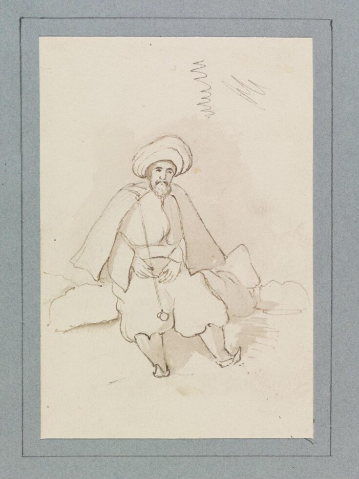 An oriental man, seated, holding a pipe top image