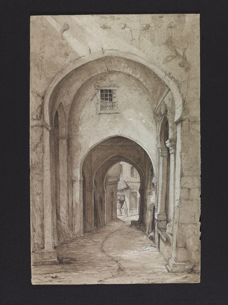A covered street with arches, in Algeria top image