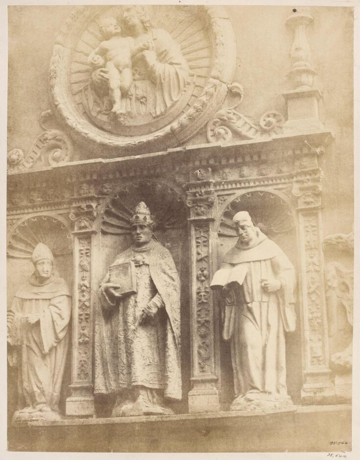 Statues on the facade of a building top image