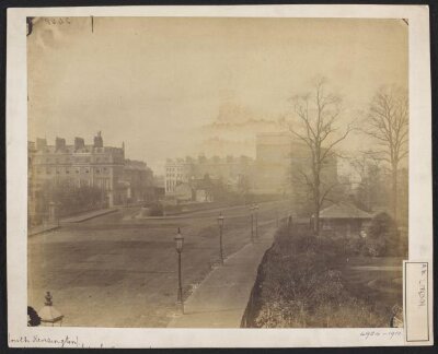 Looking south-west along Cromwell Road, showing the junction of Thurloe Place; the South Kensington Museum Gardens and Entrance on the right