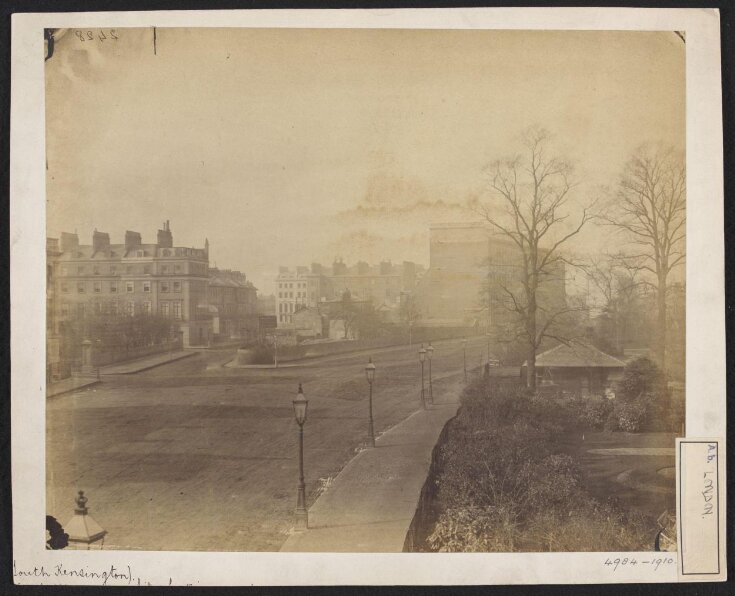 Looking south-west along Cromwell Road, showing the junction of Thurloe Place; the South Kensington Museum Gardens and Entrance on the right image