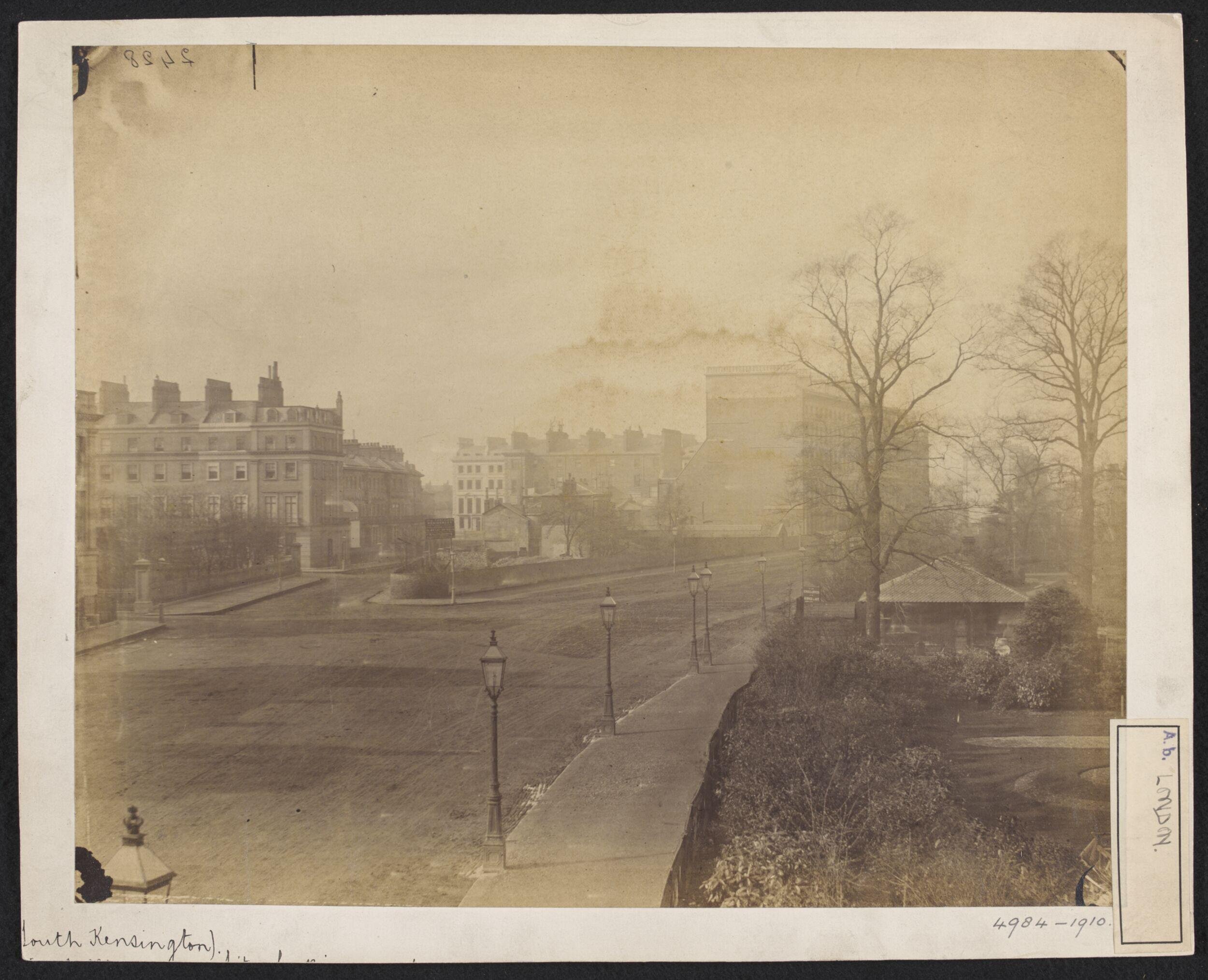 Looking south-west along Cromwell Road, showing the junction of Thurloe Place; the South Kensington Museum Gardens and Entrance on the right