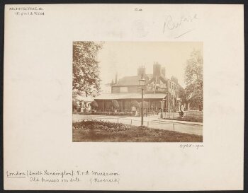 Brompton Park House with transportation wagons parked at side of building