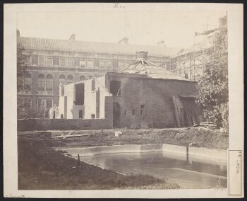 Exterior view of the first Lecture Theatre, South Kensington Museum from the south east with the west side of quadrangle (Residences) and north side of quadrangle under construction (lecture theatre block) in background