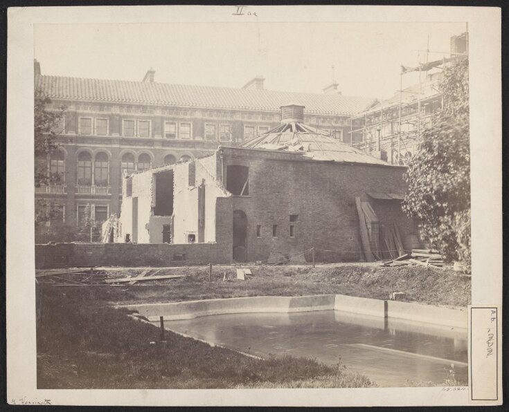 Exterior view of the first Lecture Theatre, South Kensington Museum from the south east with the west side of quadrangle (Residences) and north side of quadrangle under construction (lecture theatre block) in background image
