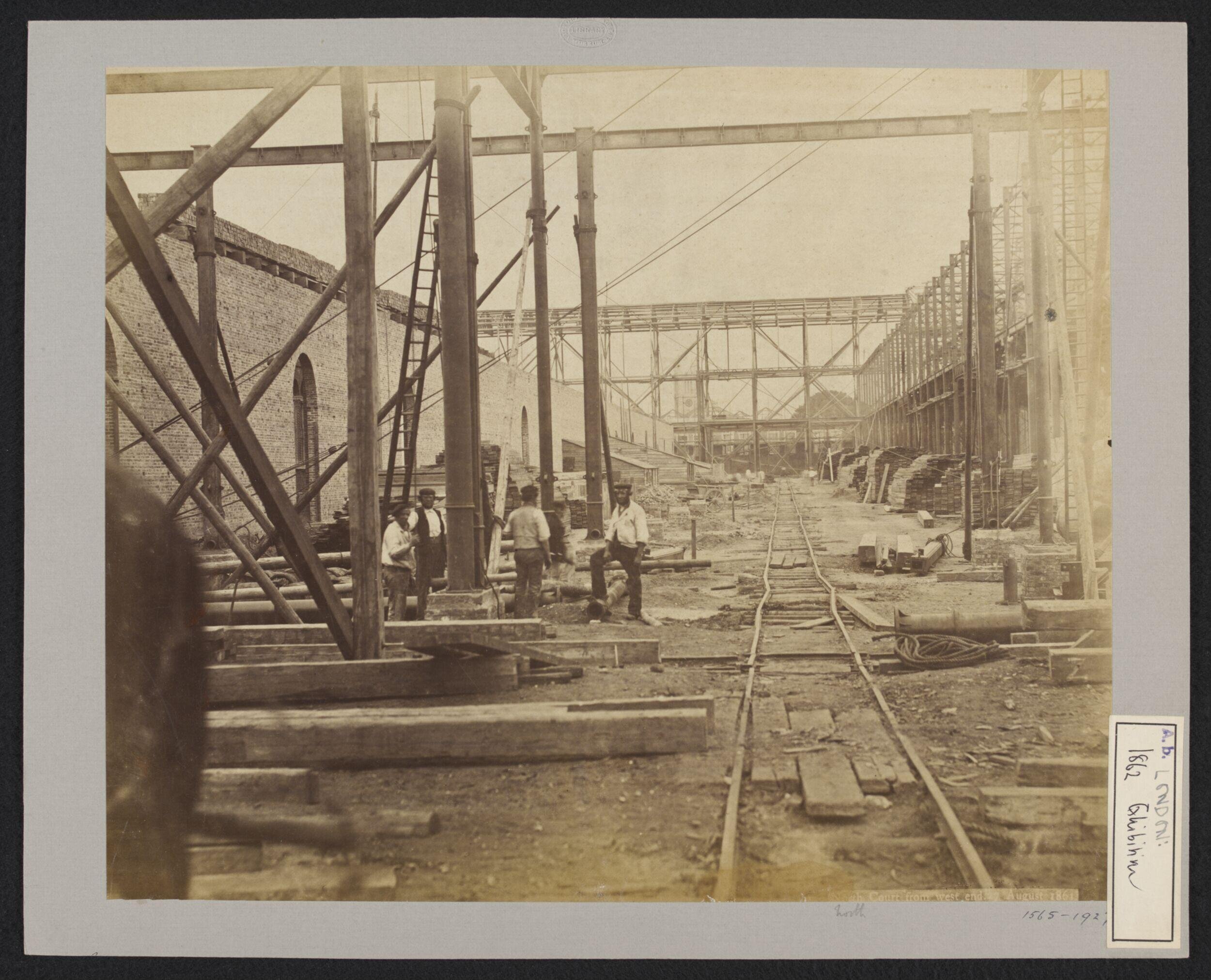 Construction of 1862 International Exhibition buildings, looking east, north court, with tower of Holy Trinity Brompton in background