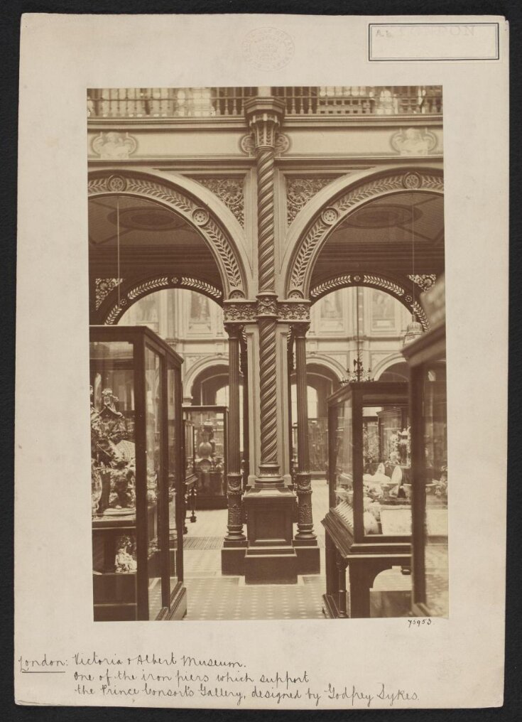 South Kensington Museum, Interior view of South Court, looking eastward from Gallery 38 into Gallery 39, showing display cases in foreground and columns supporting Prince Consort Gallery top image