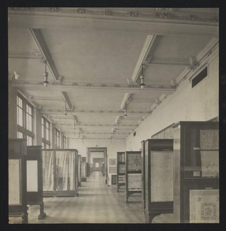 Victoria and Albert Museum, Gallery 120 showing display cases of textiles top image
