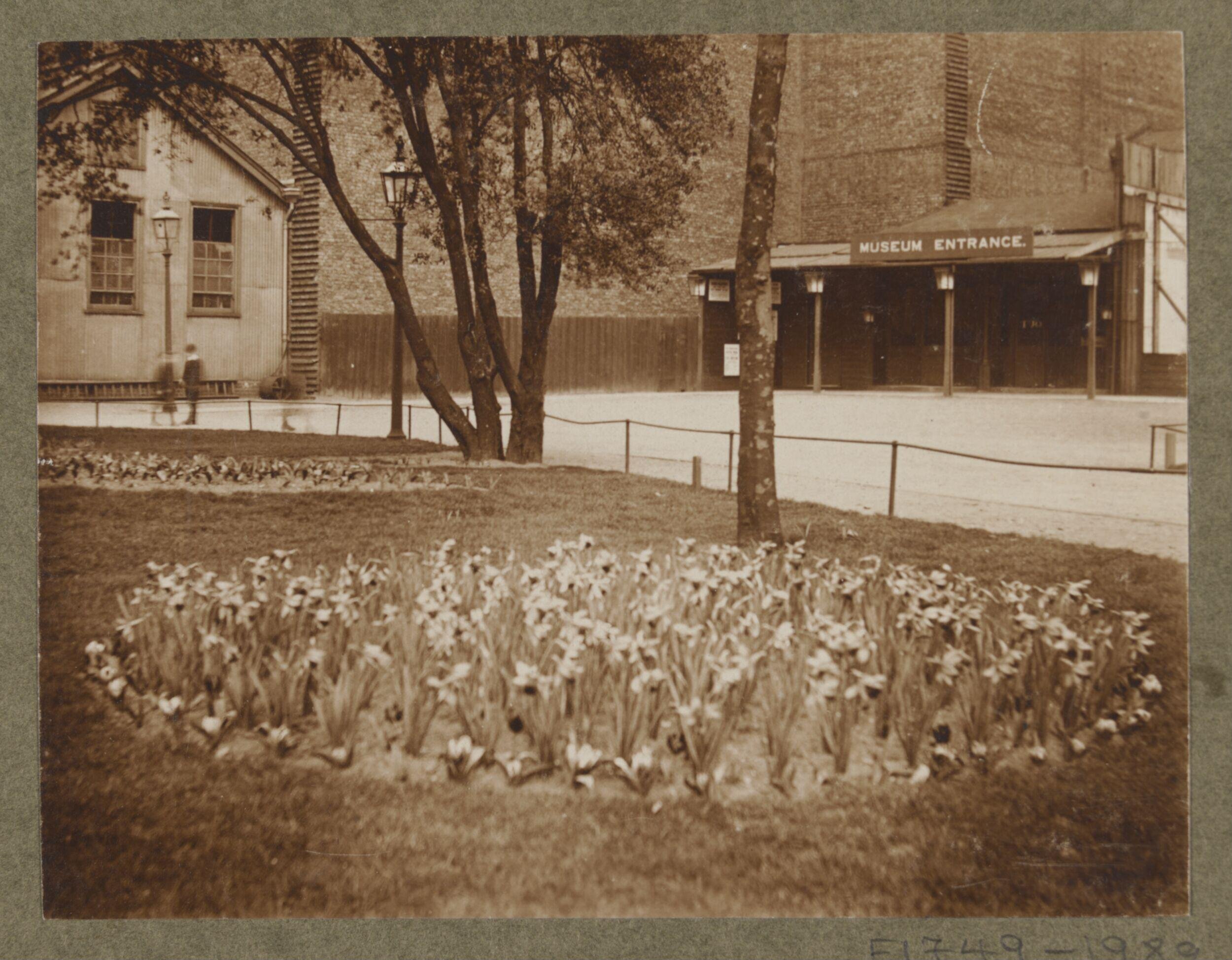 South Kensington Museum, entrance with Cast Courts on the left and flower bed