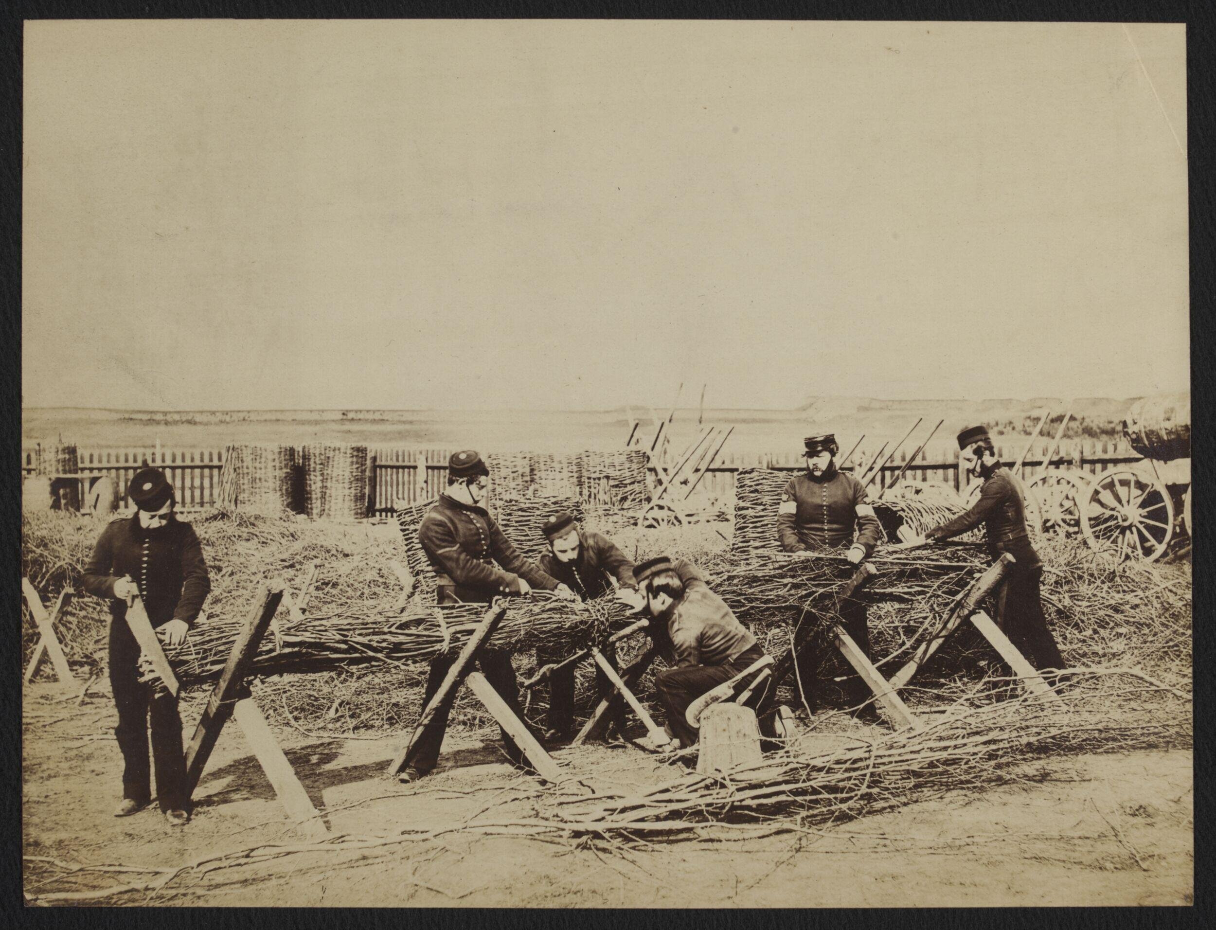 Sappers constructing a float (bridge?) for canvas pontoon boats