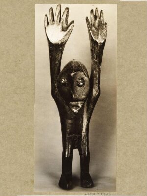 Figure with arms raised. WaRegga.