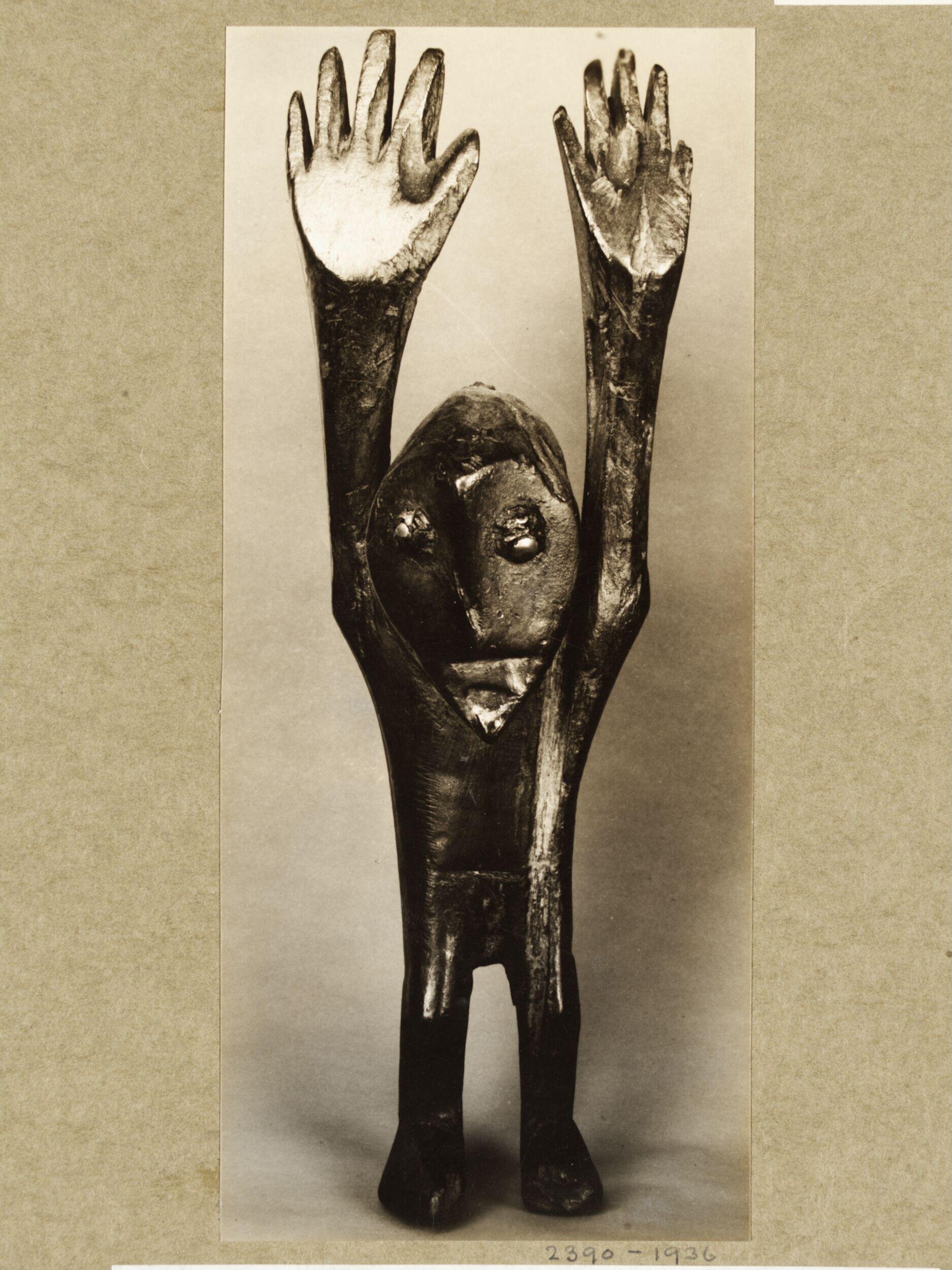 Figure with arms raised. WaRegga.