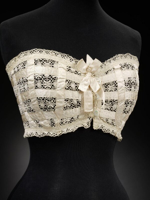 Woman's Bust Improver (Falsies). England, circa 1900. Costumes; underwear  (upper body). Cotton plain weave with cotton lace and silk satin ribbon  trim - SuperStock