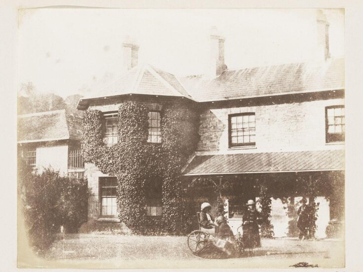 Group with bathchair in front of Rheola House top image