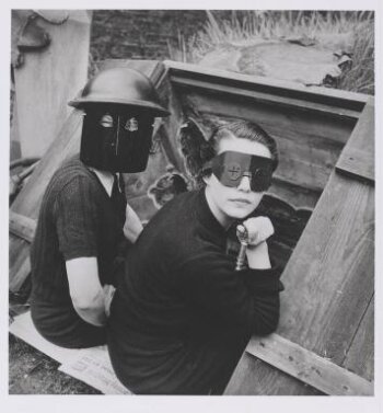 Photograph by Lee Miller, 'Women with fire-masks, Downshire Hill, London, England', from the portfolio 'Quintessential Lee Miller'