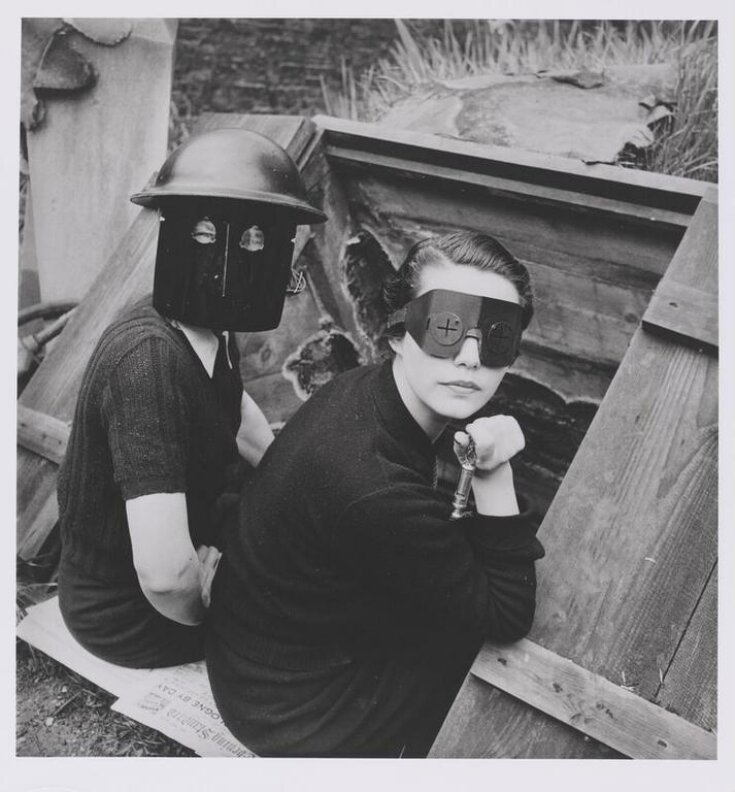 Photograph by Lee Miller, 'Women with fire-masks, Downshire Hill, London, England', from the portfolio 'Quintessential Lee Miller' top image